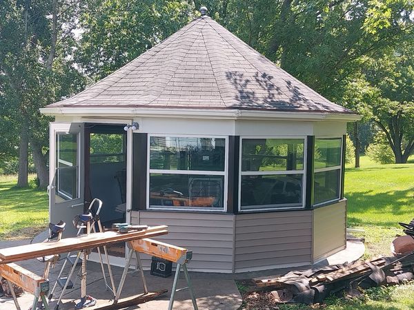 Gazebo reskin in progress with new windows and siding